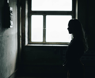 Kairos Women Working Together - a silhouette of a prisoner