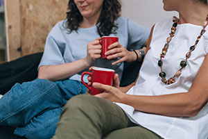 Imago Dei Prison Ministry - two women talk on sofa