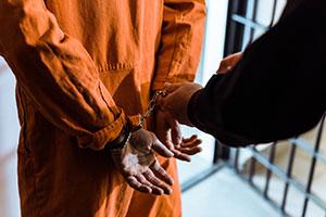 Inmate in handcuffs for safety and officer